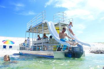 a group of people on a boat in the water