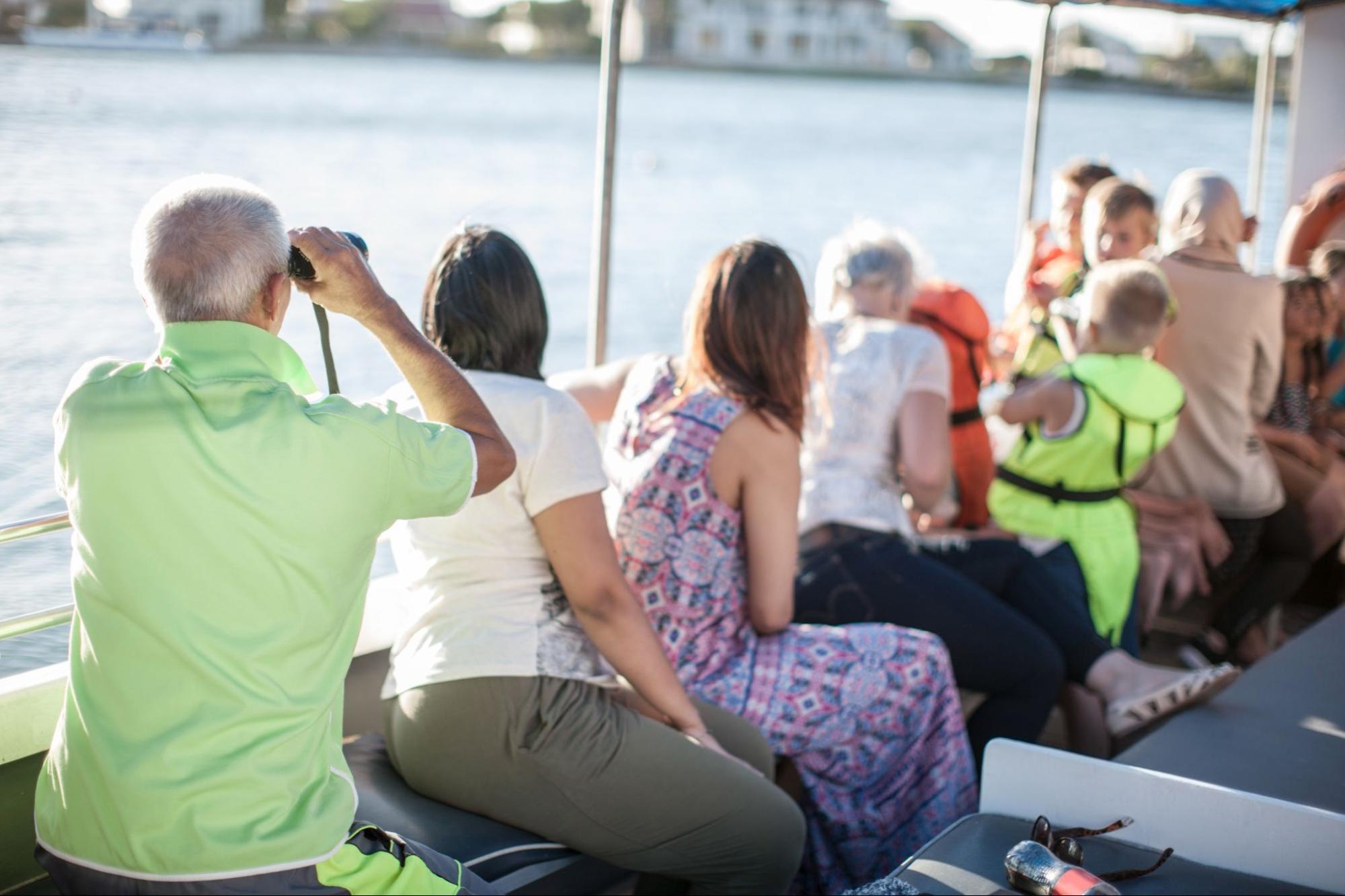 a group of people sitting in the water