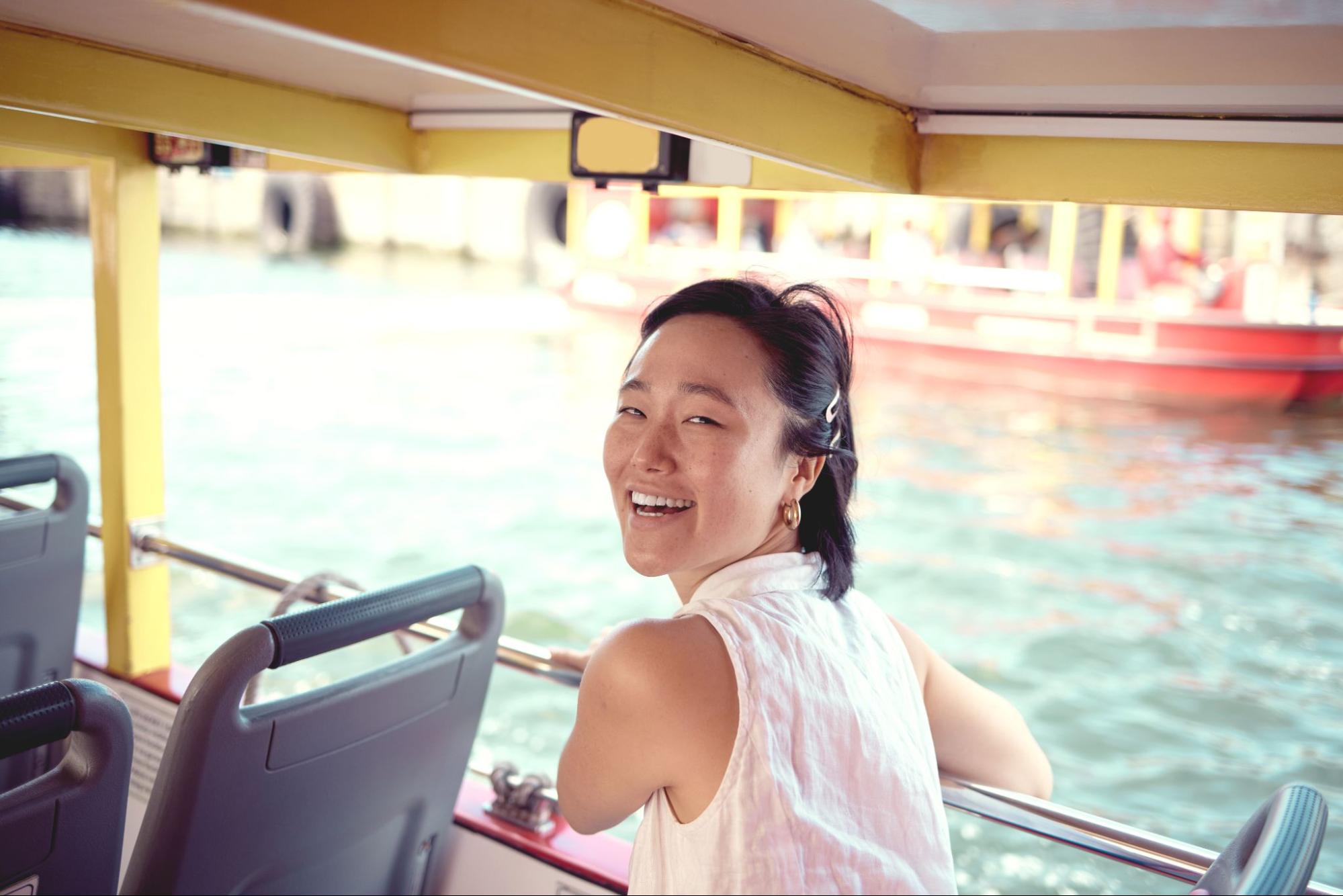 Woman smiling on a boat. 