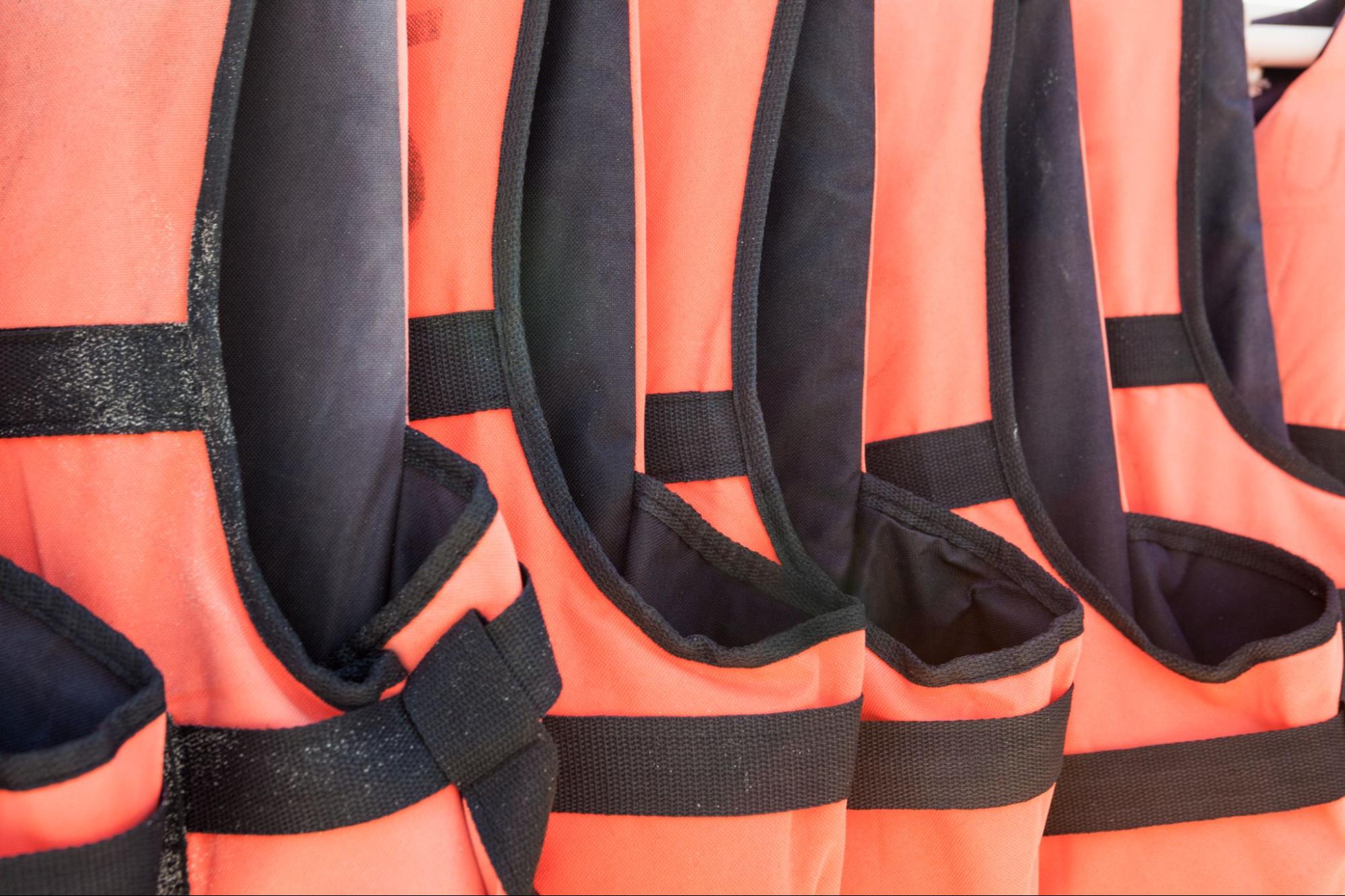 Lifejackets lined up in a row. 